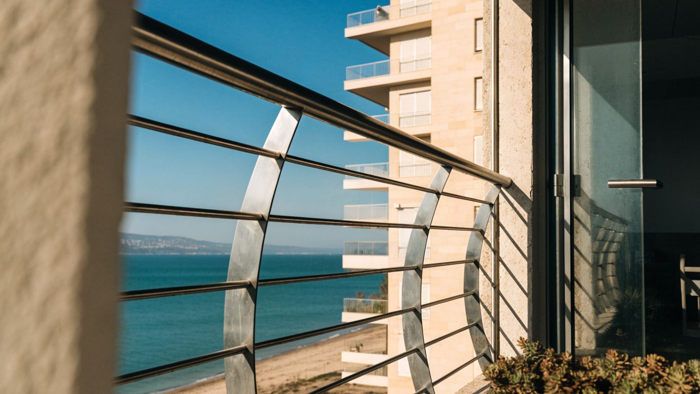 Stainless steel balcony railing on a seafront apartment building in Limassol